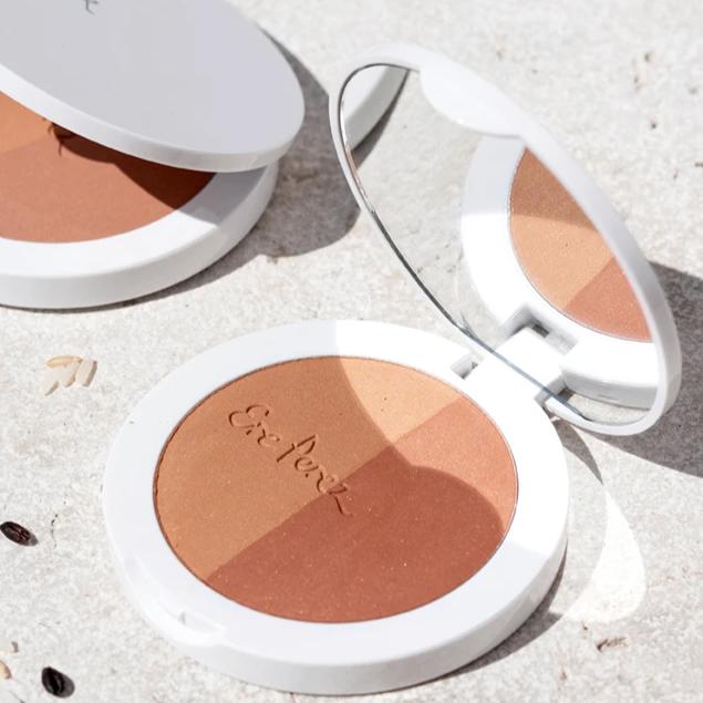 Two open containers of Ere Perez Rice Powder Bronzer in the Sun